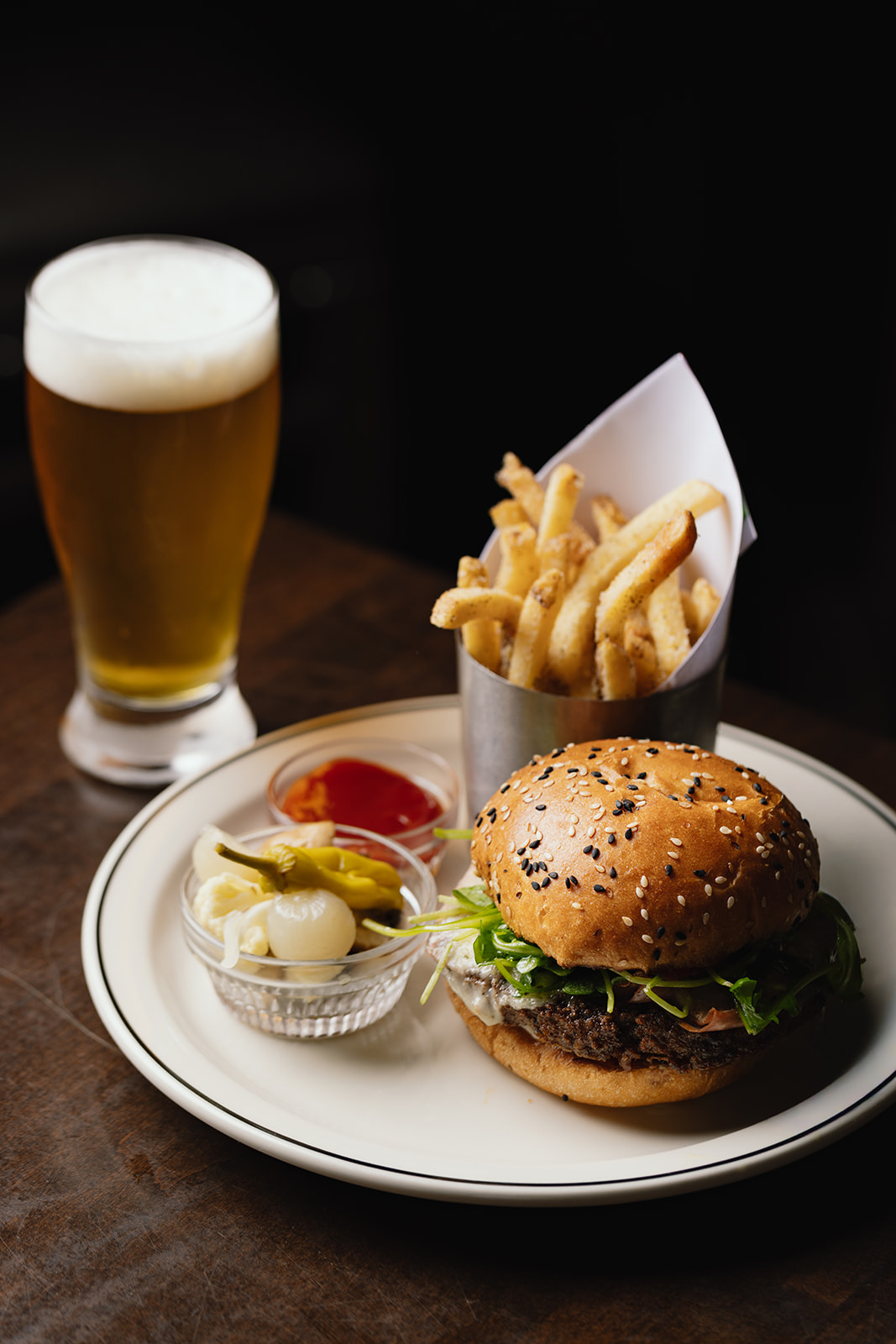 Burger with fries and a beer