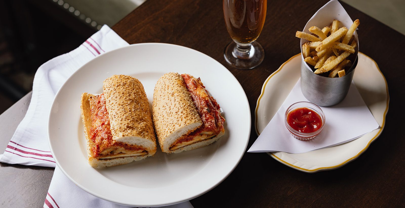 Sandwiches at Brickmen with fries and a beer